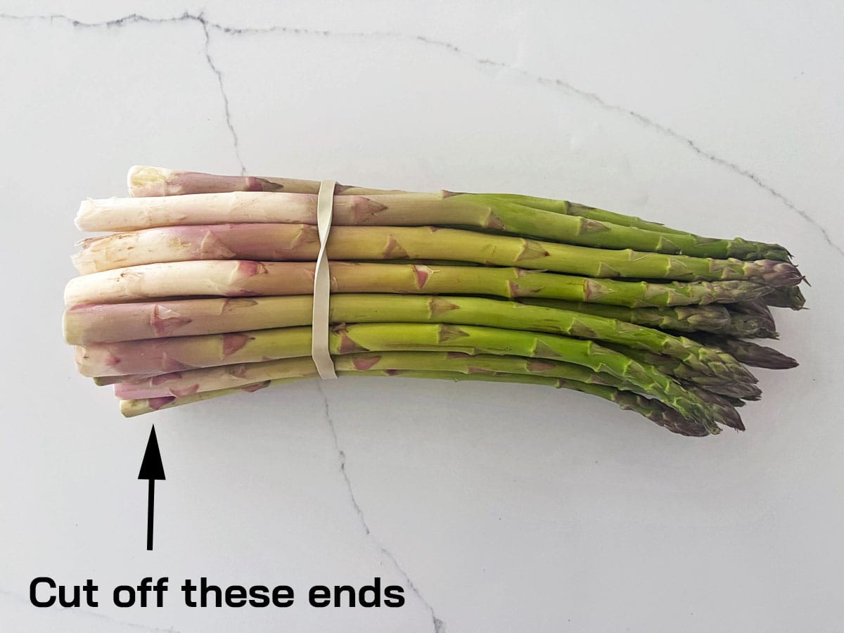 Cutting asparagus ends.