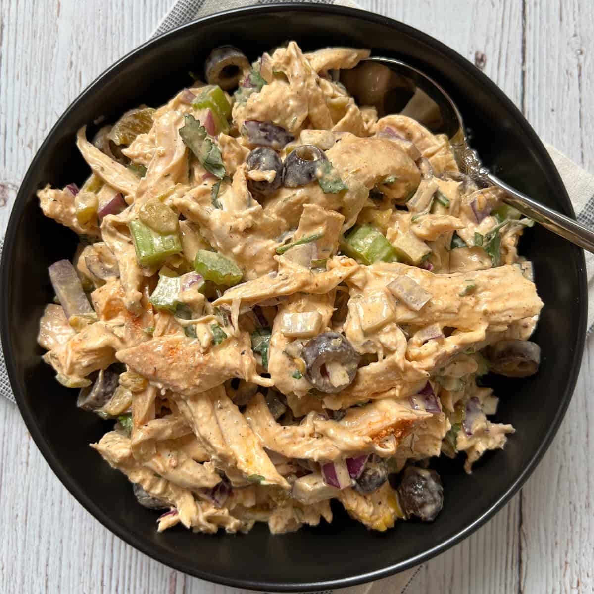 A chicken salad variation made with sriracha mayo, black olives, and diced green chiles.