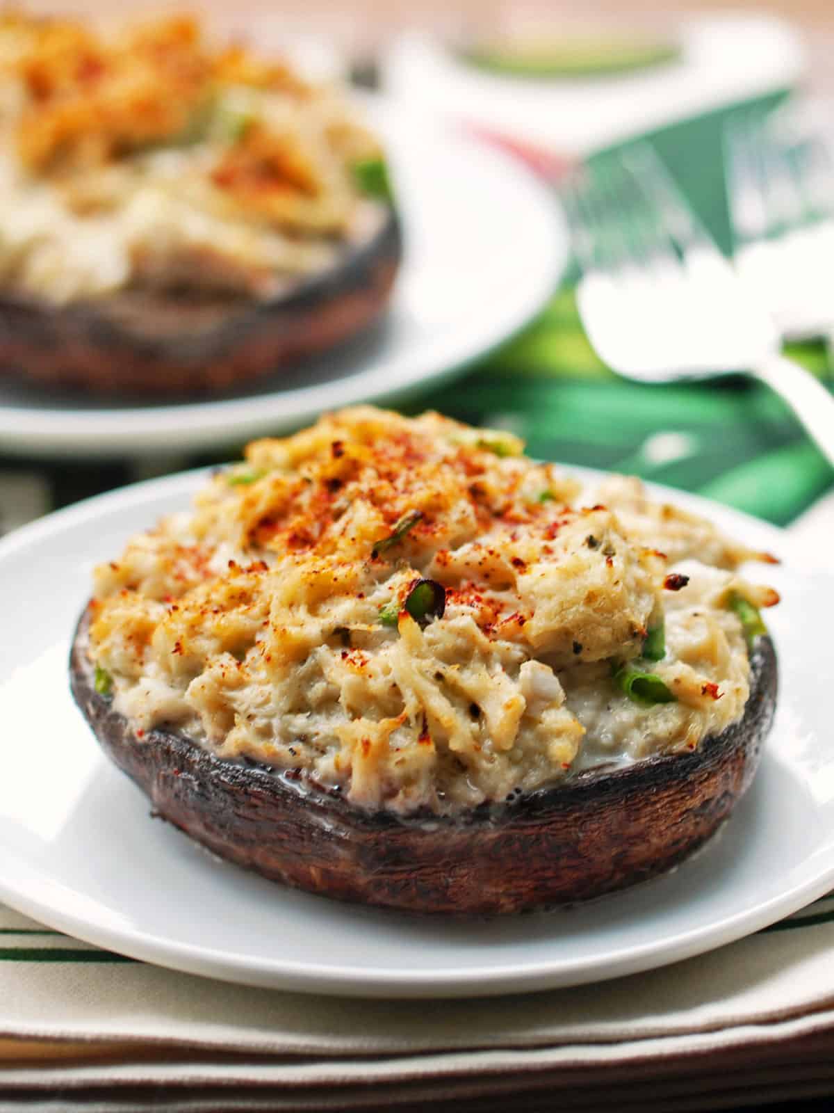 Two crab-stuffed portobello mushrooms.