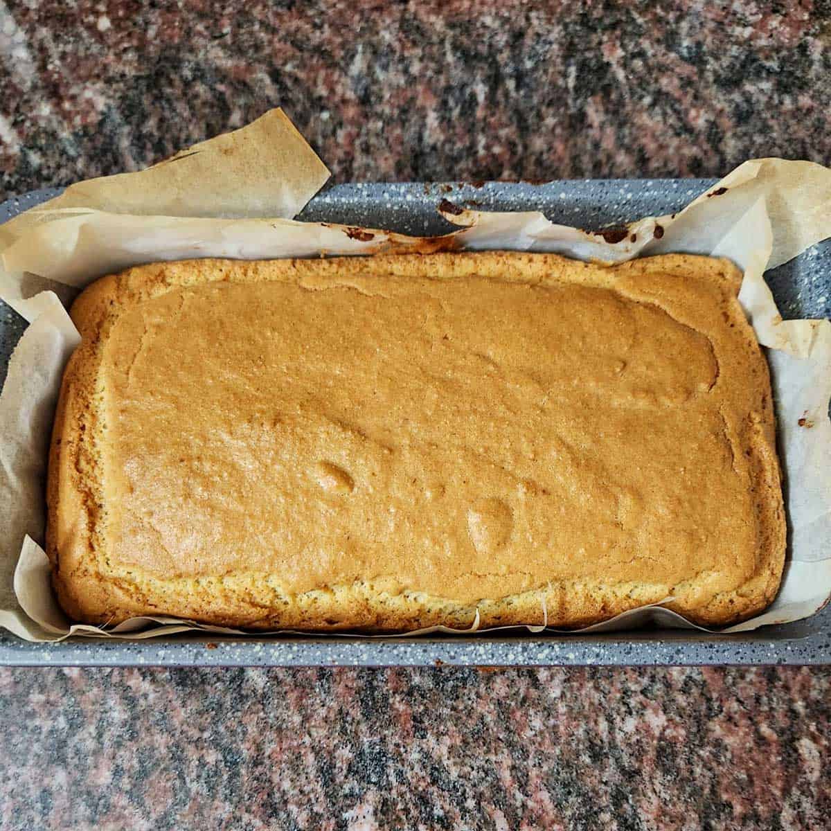 A loaf of almond flour bread in a 9x5-inch pan.