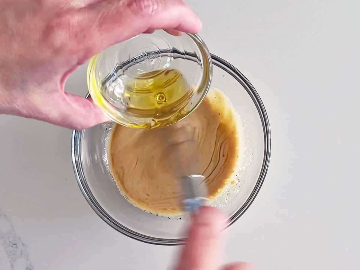 Mixing the dressing.