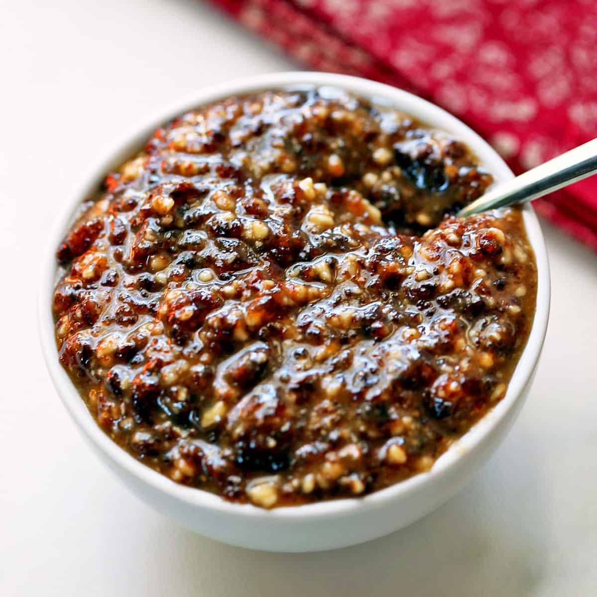 Charoset is served in a white bowl.