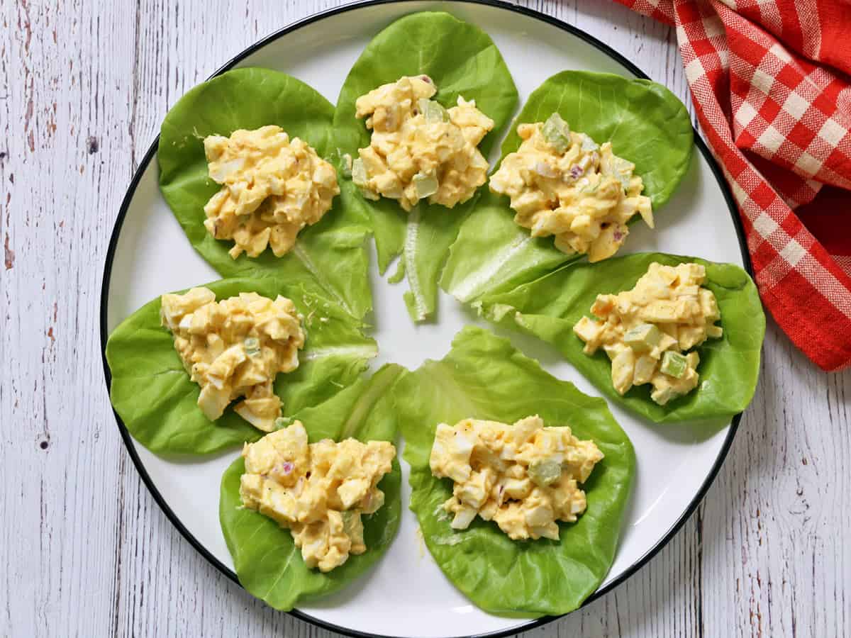 Egg salad is served on lettuce.