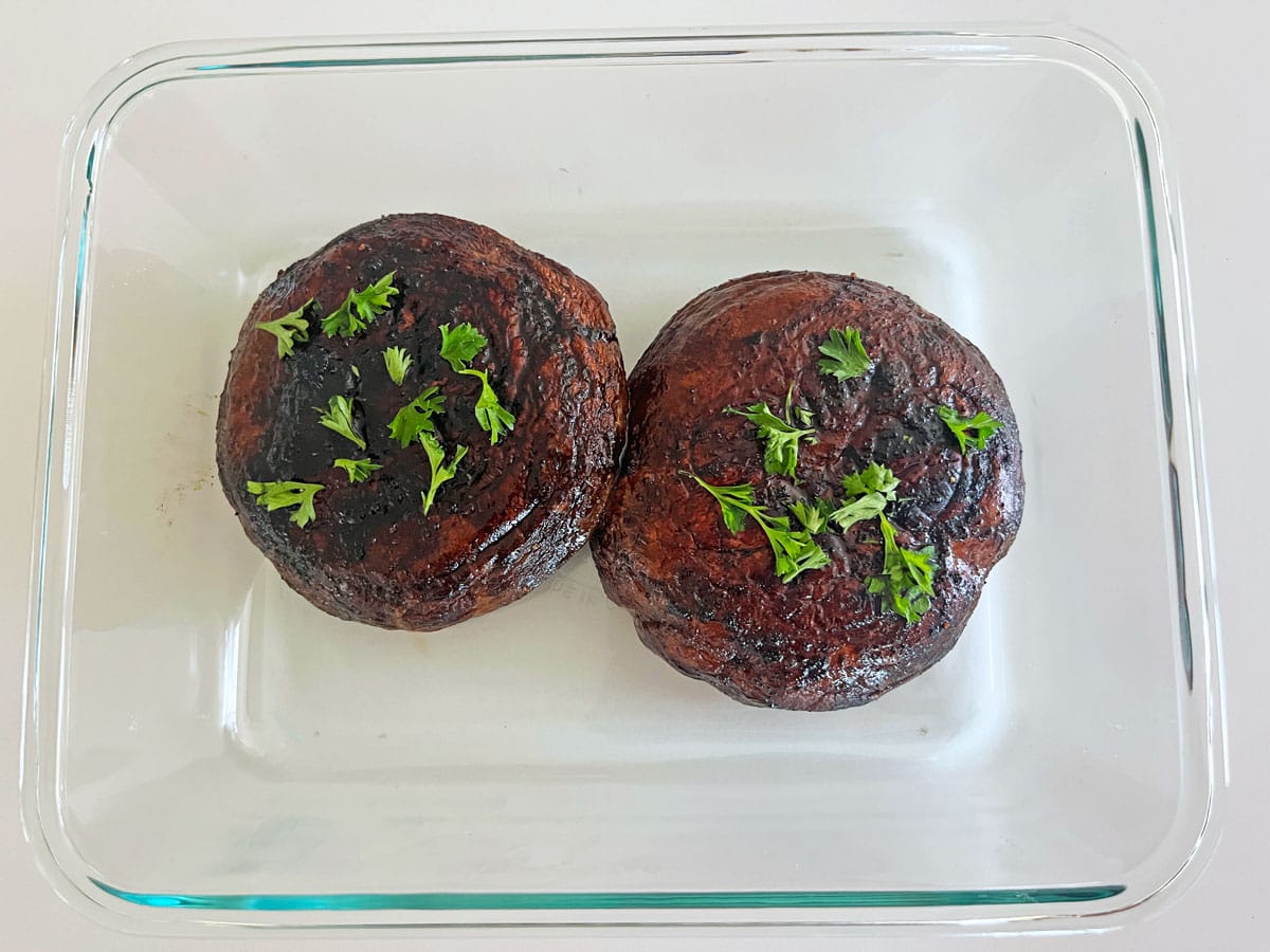Leftover portobellos are kept in a glass food storage container.