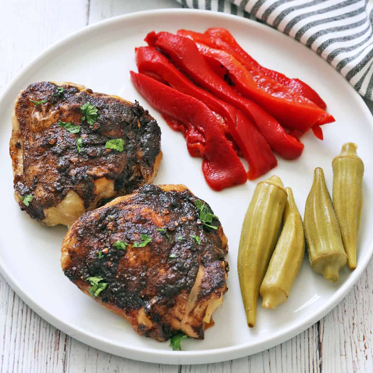 Jerk chicken leftovers are served with pickles.