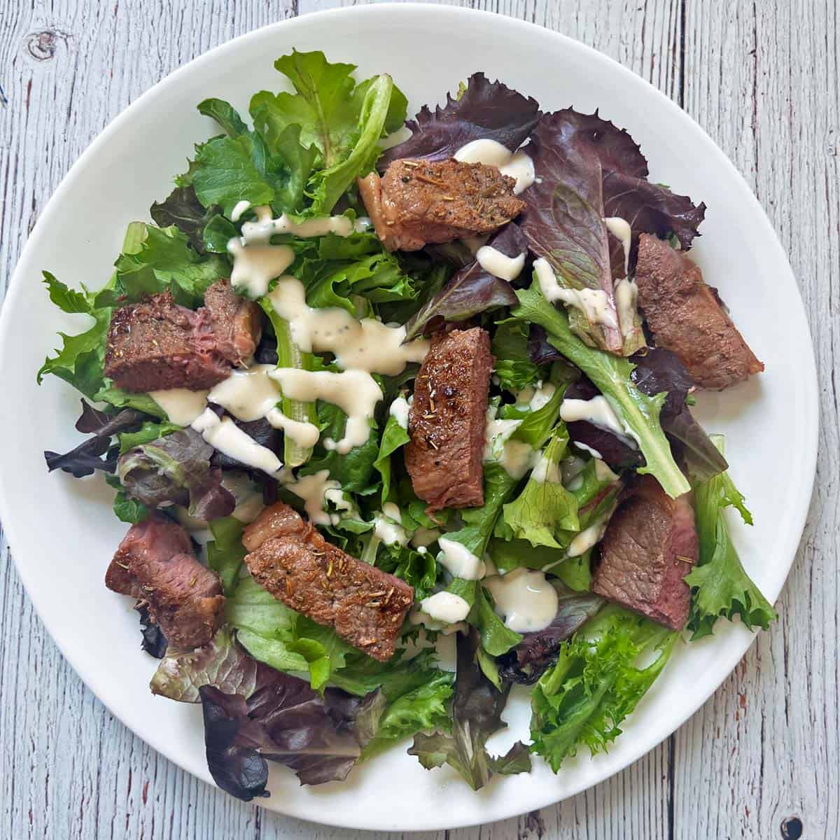 Leftover lamb steak pieces were added to a salad.