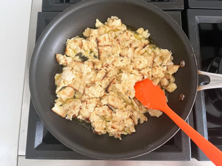 Scrambling the matzo brei in the skillet.