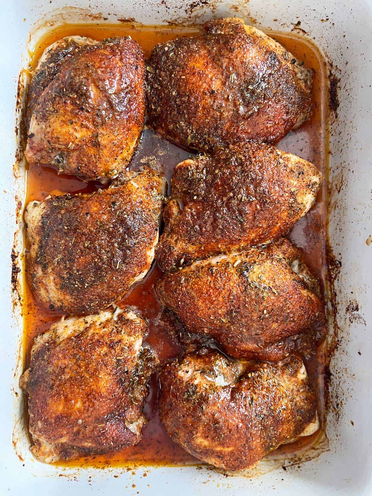 Cajun chicken in a baking dish.