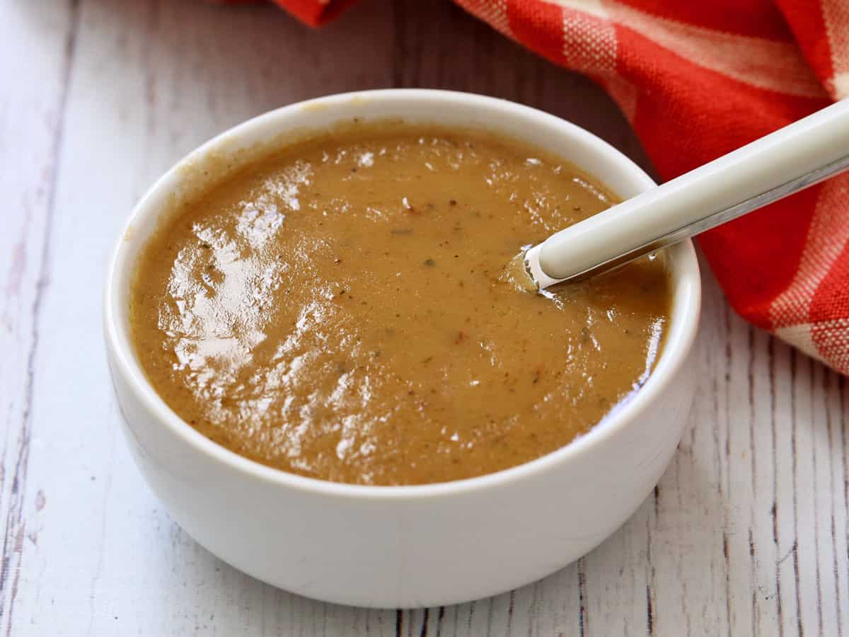 Gravy is served in a bowl.