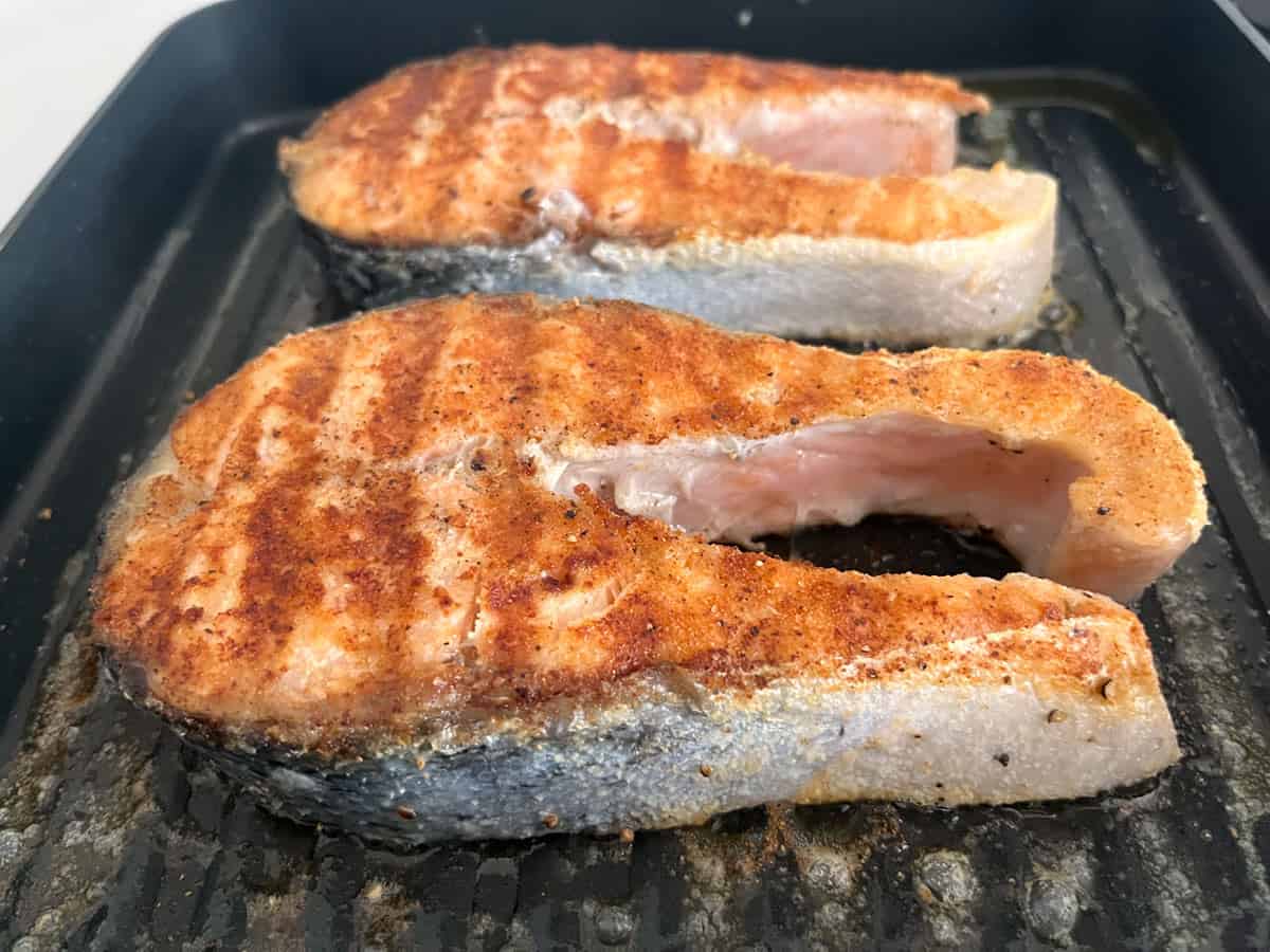 Large salmon steaks before the oven.