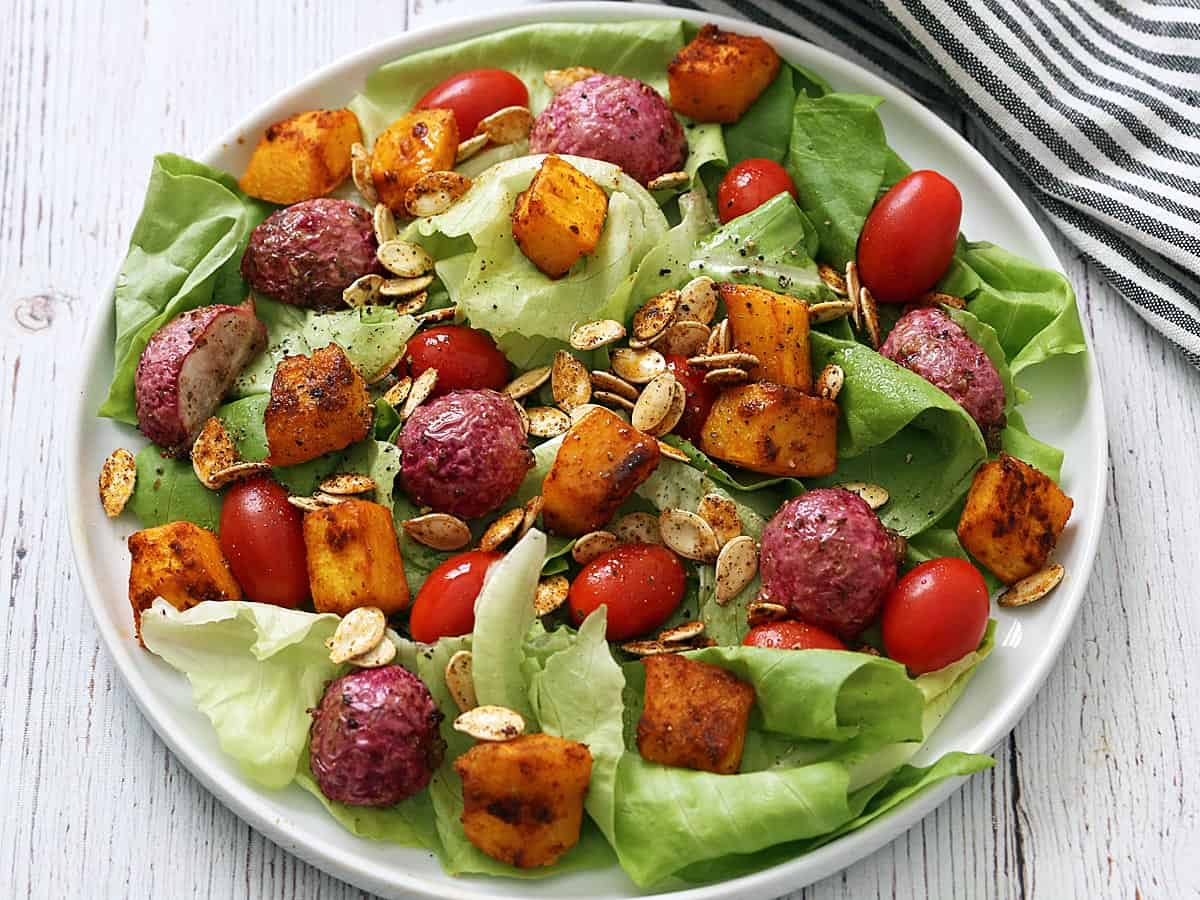 Pumpkin seeds are served in a salad.