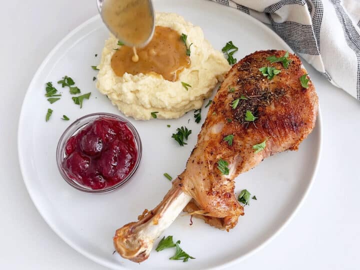 Spooning the gravy on mashed cauliflower.