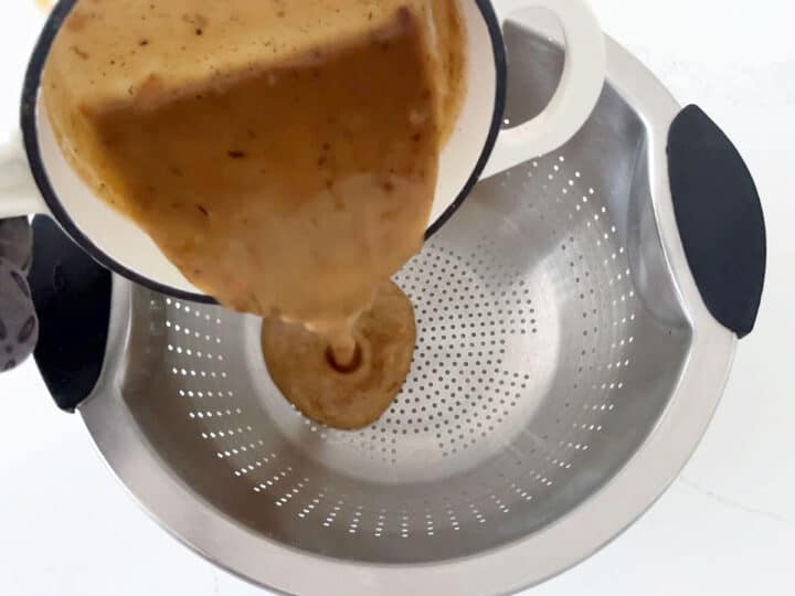 Straining the gravy.