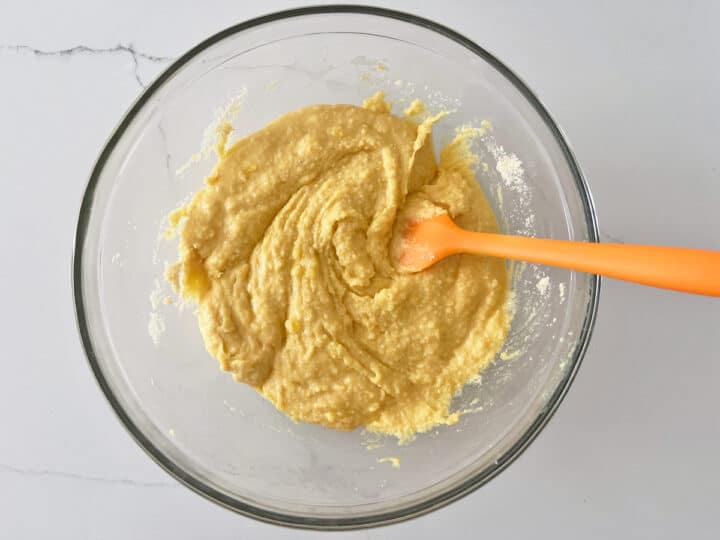Mixing the flour into the batter.