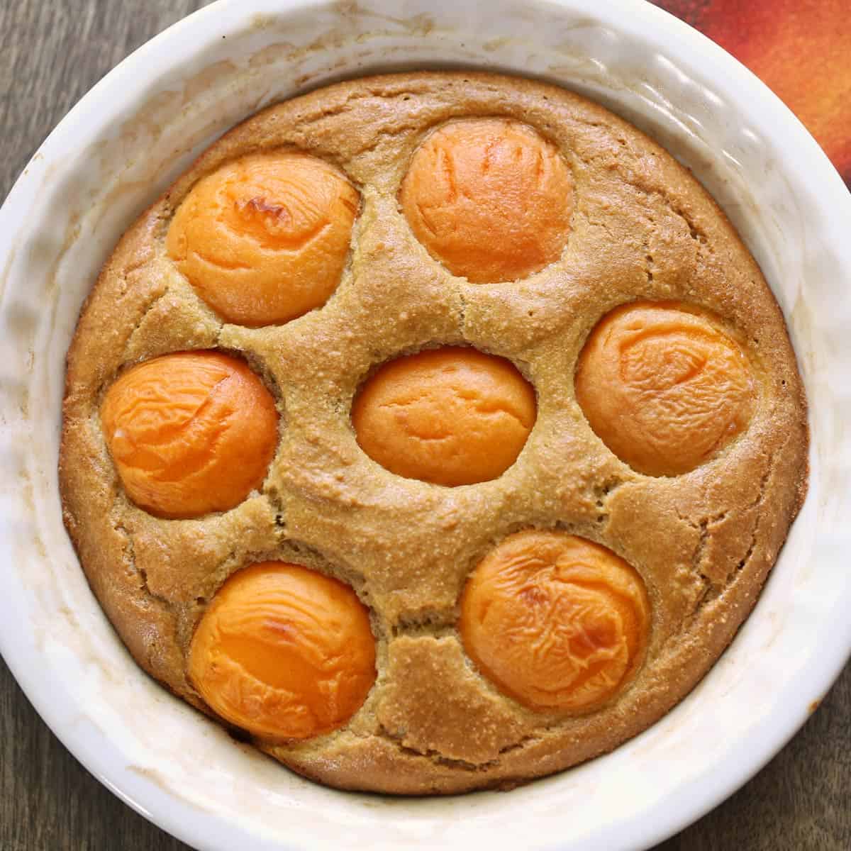 Almond flour apricot cake in a pan.