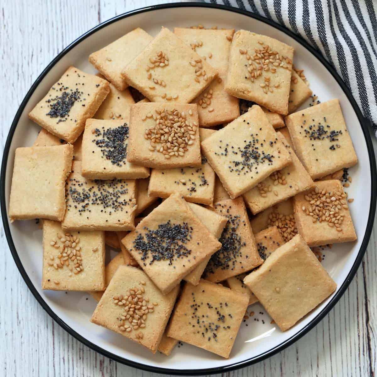 Almond flour crackers topped with sesame and poppy seeds.