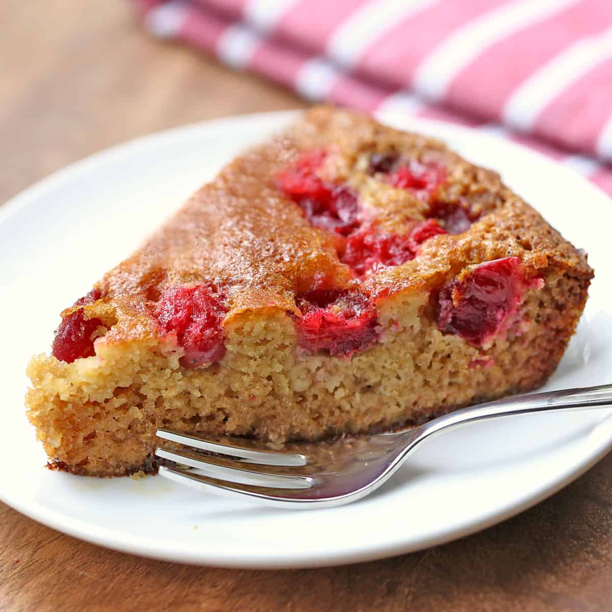 A slice of almond flour cranberry cake.