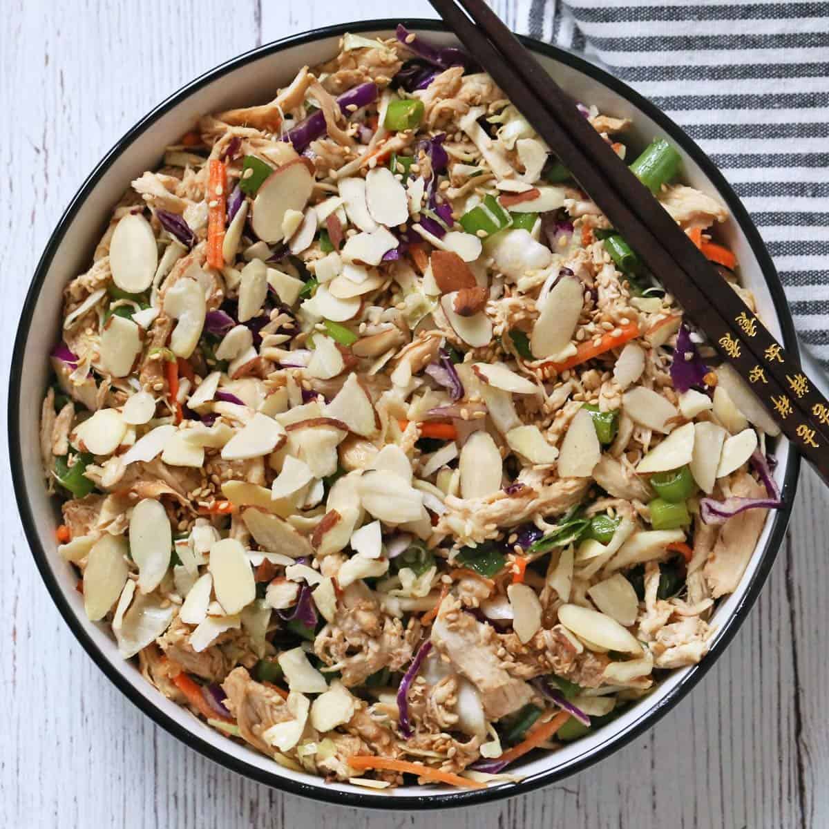 Chinese chicken salad is topped with slivered almonds.
