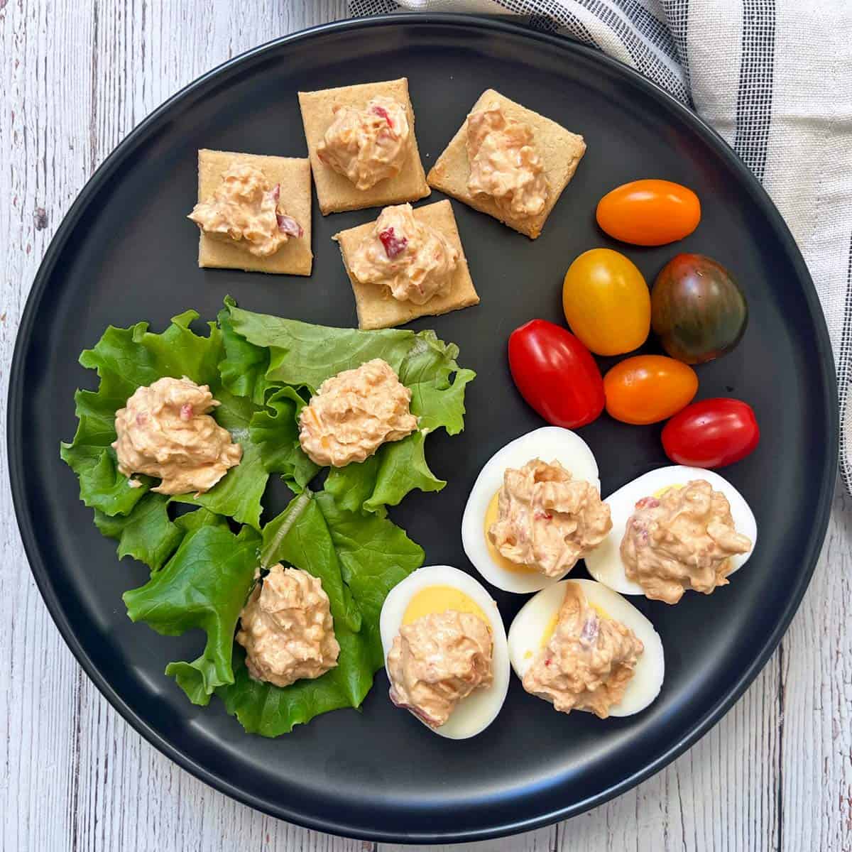 Pimento cheese is served on eggs, crackers, and lettuce.
