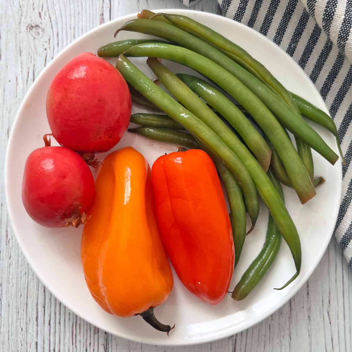 A quick pickles variation with green beans, mini peppers, and radishes.