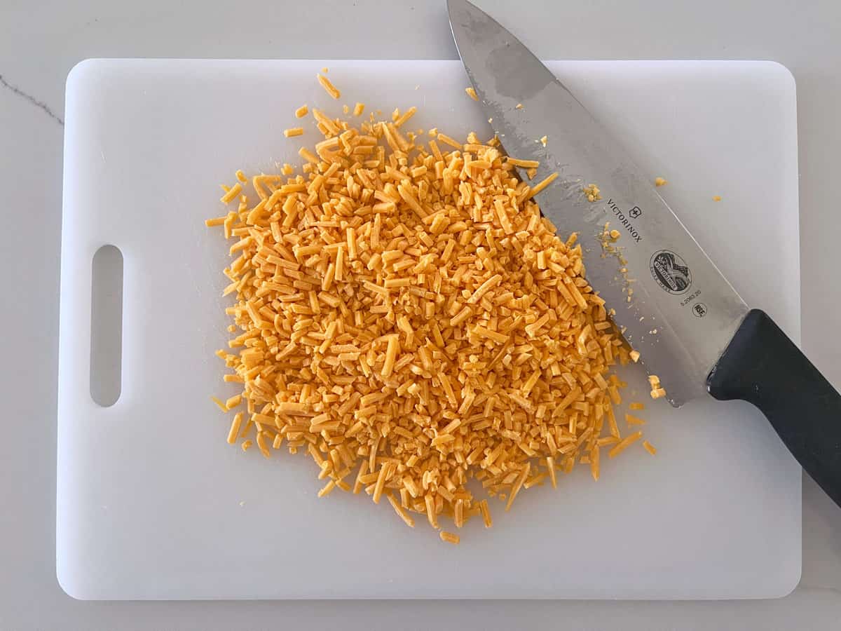 Coarsely shredded cheese was chopped.