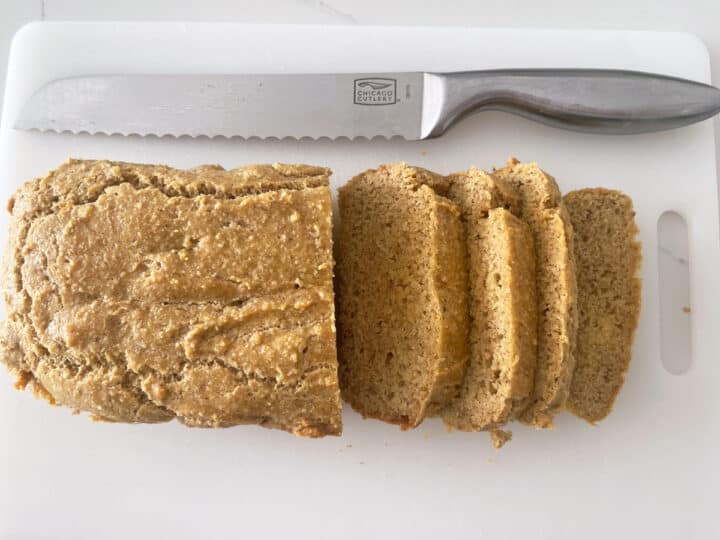 The bread was sliced on a cutting board.