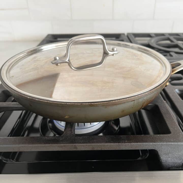 Covering the skillet.