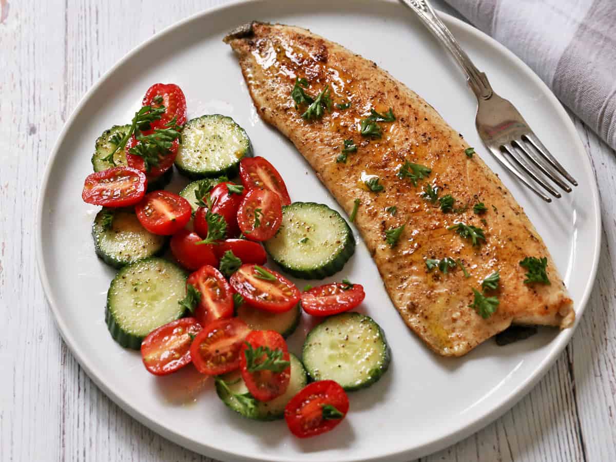 Rainbow trout is served with a salad.