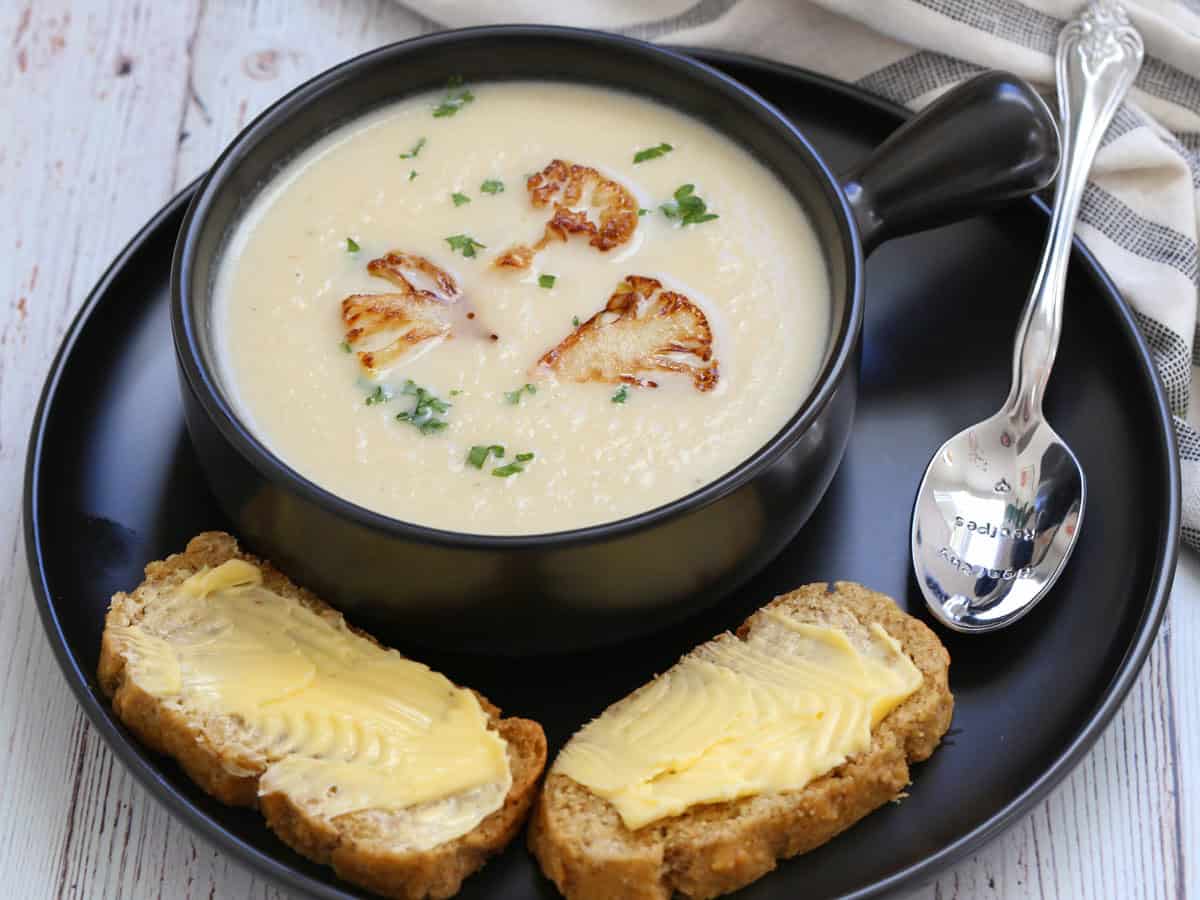 Cauliflower soup is served with almond flour bread.