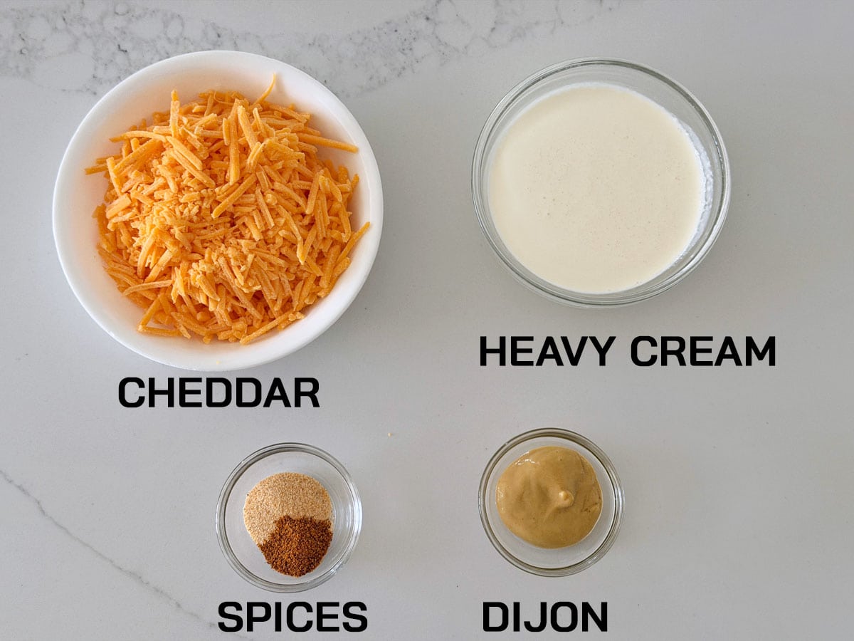 The ingredients needed to make a cheese sauce.