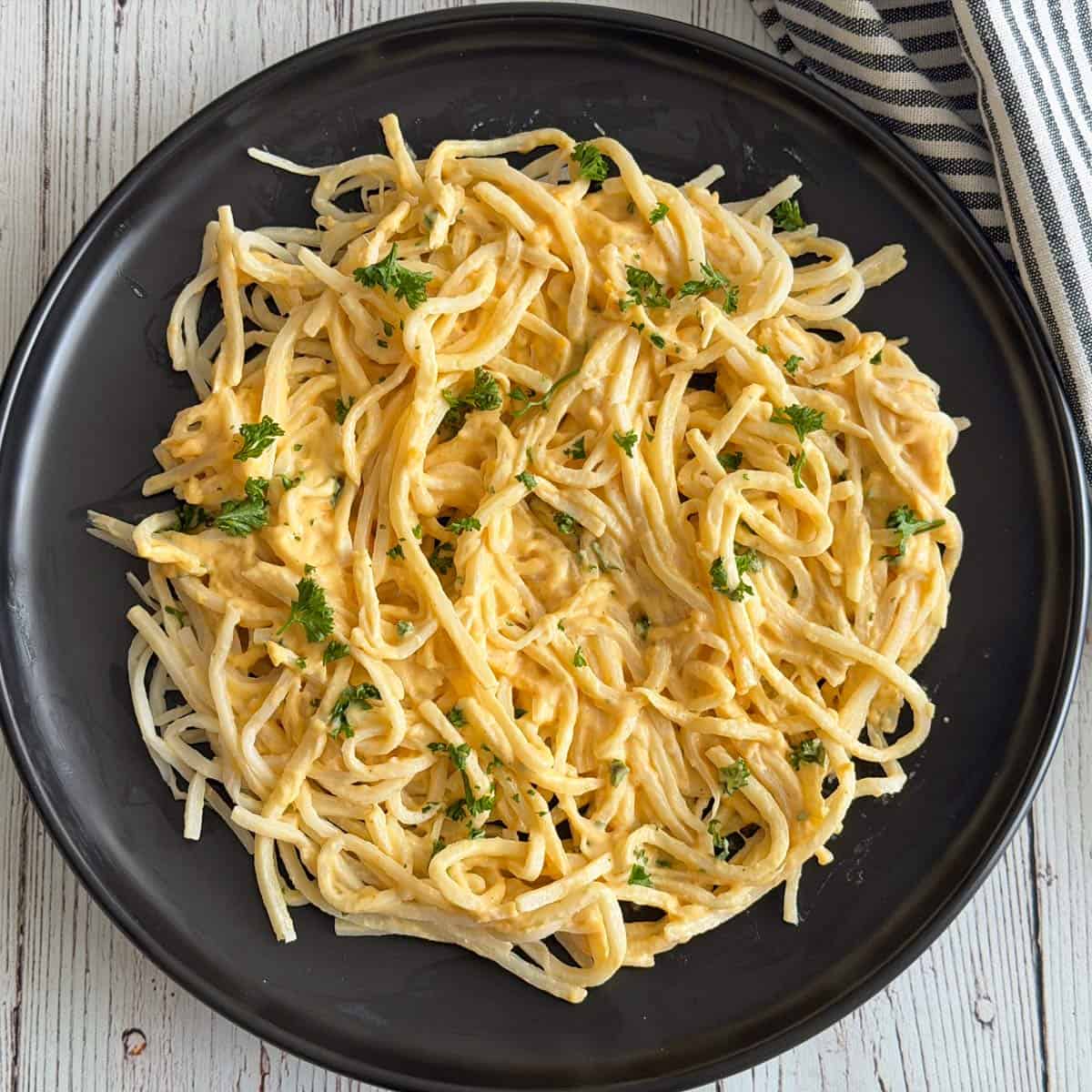 Cheese sauce is mixed into hearts of palm pasta.