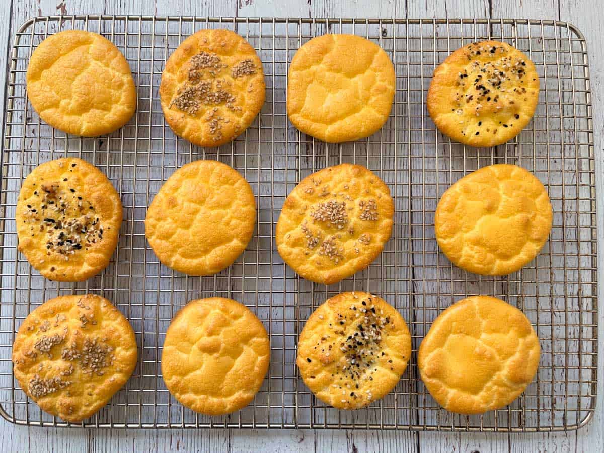 Cloud bread pieces are cooling on a cooling rack.