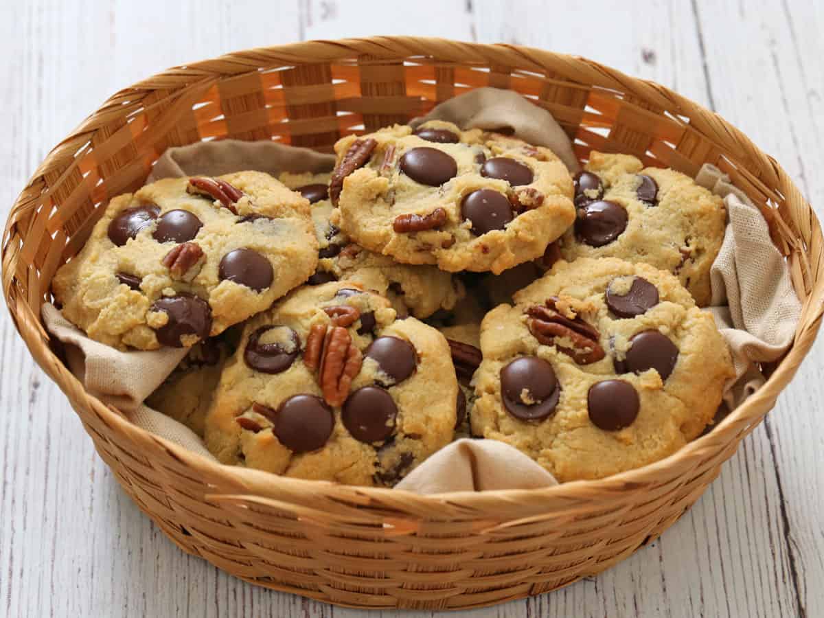 Almond flour chocolate chip cookies with pecans are served in a basket.