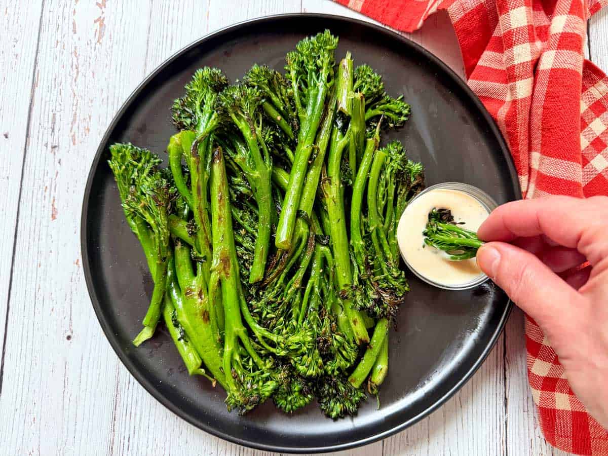 Grilled broccolini is served with tahini for dipping.