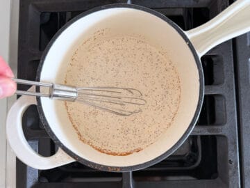 Whisking the heavy cream with Dijon and spices.