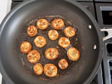 Banana slices are fried in a nonstick skillet.