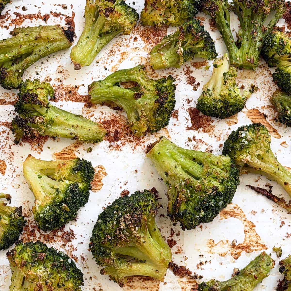 Roasted frozen broccoli on a baking sheet.