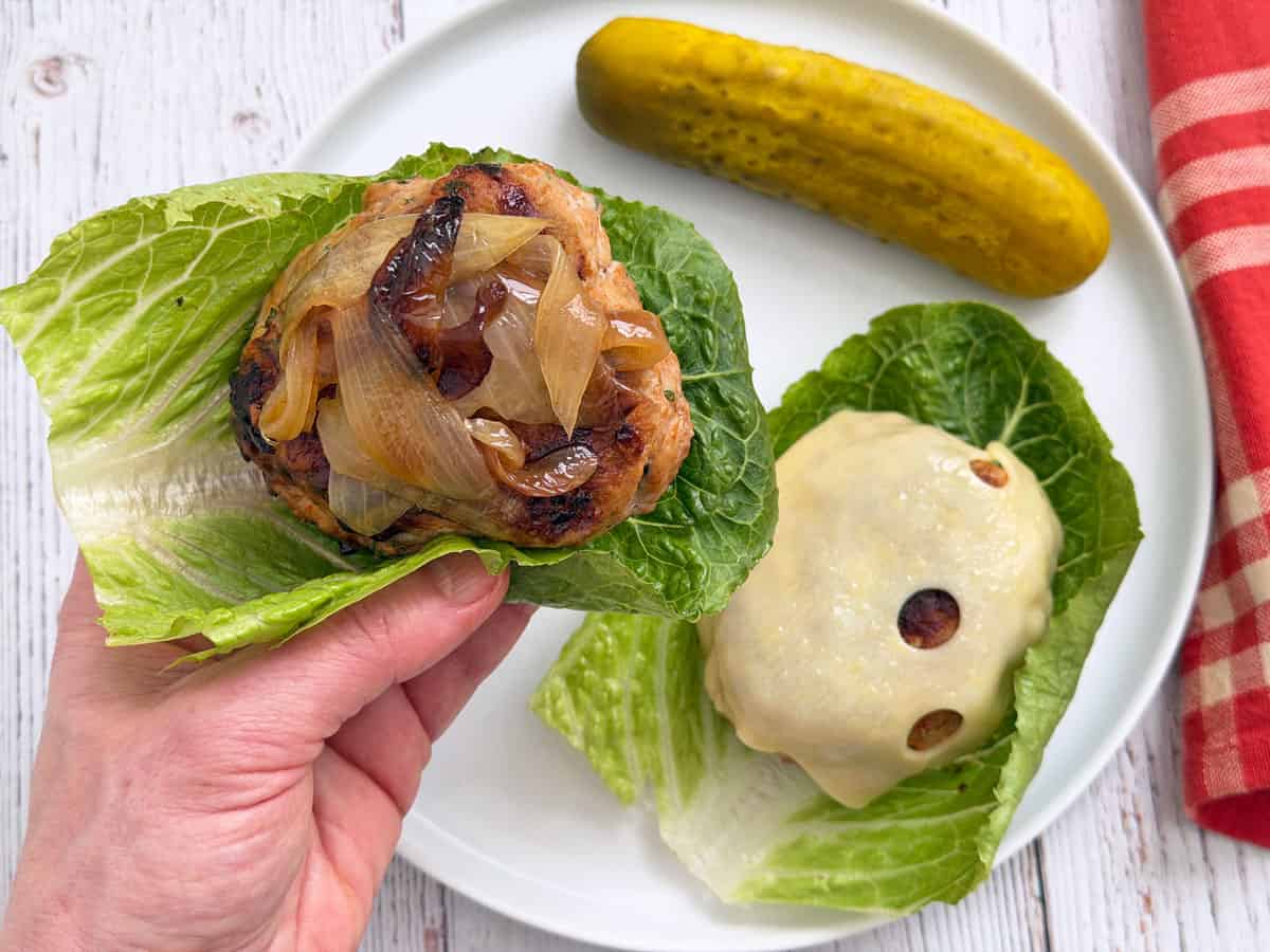 Turkey burgers are served in lettuce cups.